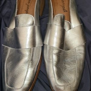 Metallic silver mules.